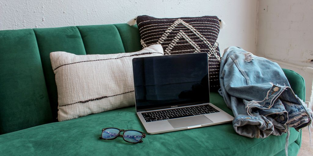black and silver laptop computer on green table