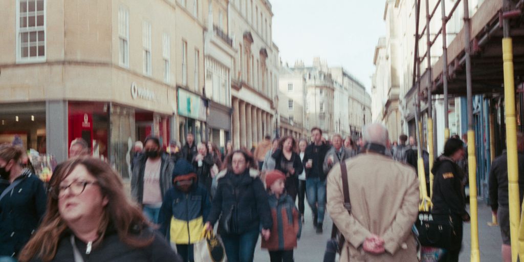 a group of people walking down a street