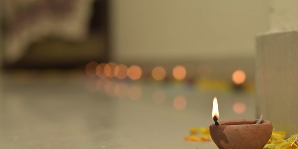 a small candle that is sitting on the ground