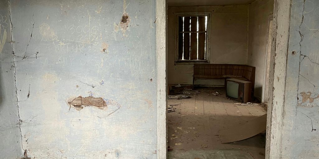 a room with a broken toilet