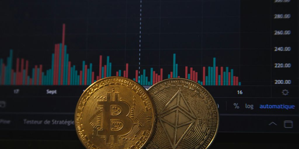 Two cryptocurrency coins in front of a financial graph.