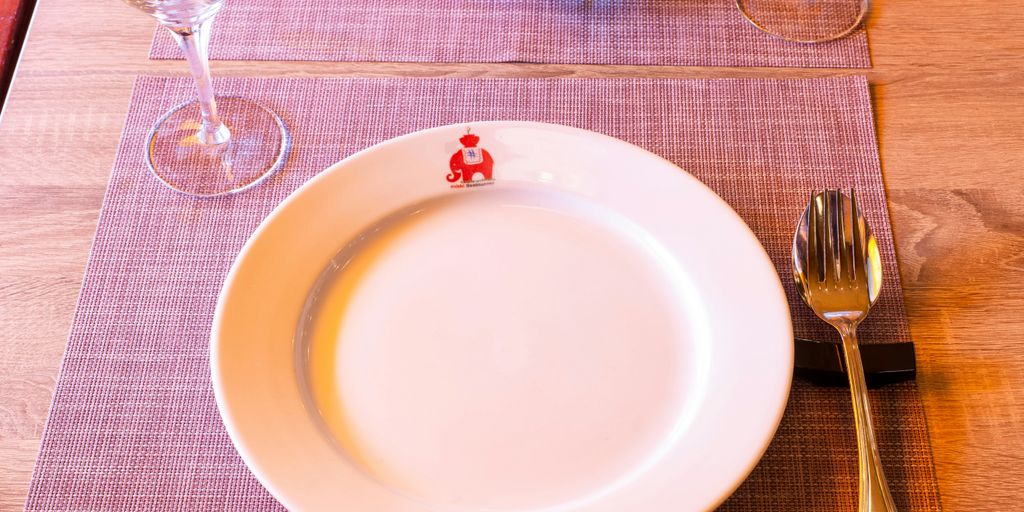 white ceramic plate on table