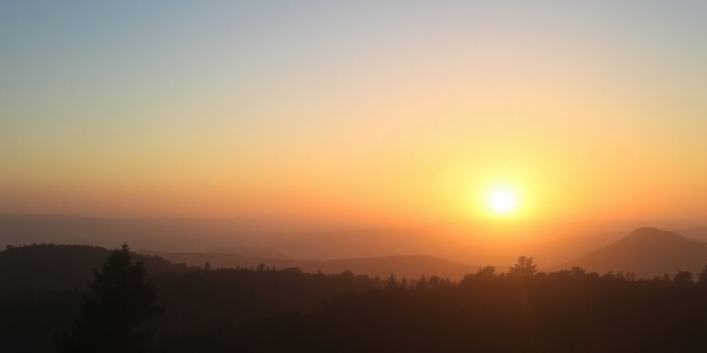 Silhouetted landscape at dawn, evoking hope and tranquility.