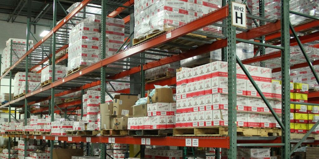 white and red cardboard boxes on shelf