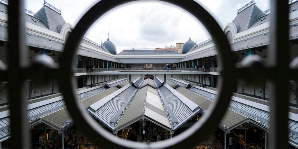 A view of a building through a circular window