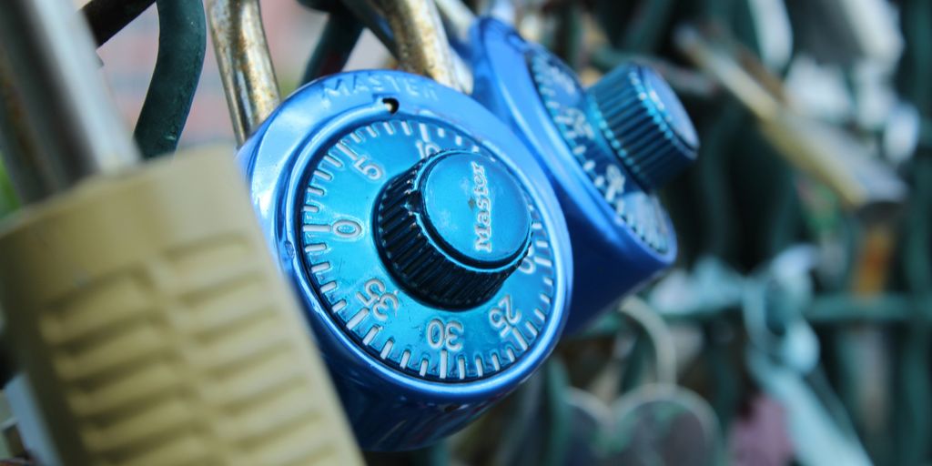 a combination combination lock attached to a fence