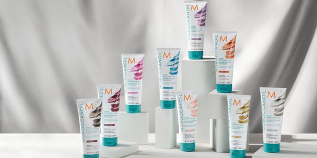 Haircare products displayed artistically with shadows and light.