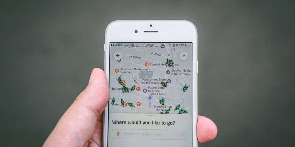 thumbnail person holding silver iPhone 6