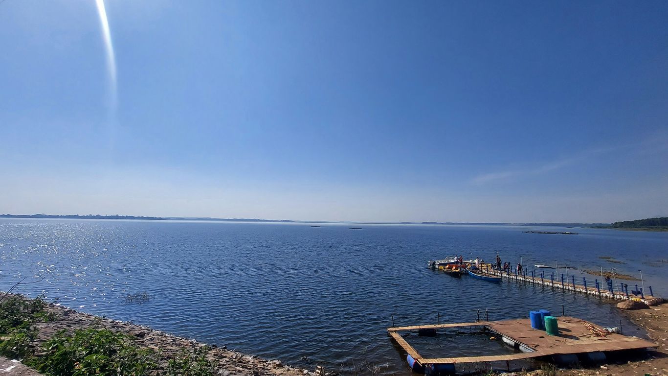 A view of a lake with a dock in the foreground