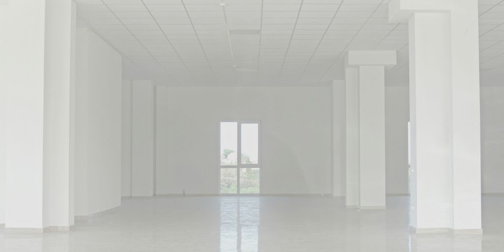 white concrete building with glass windows