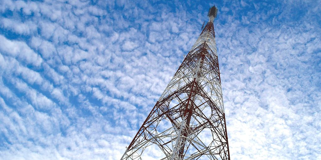 a very tall tower sitting under a blue sky