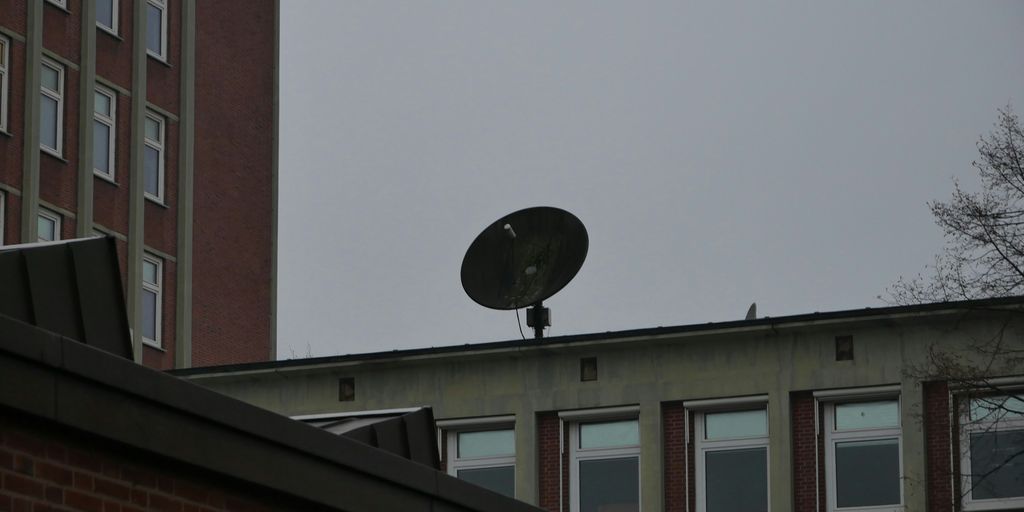 a satellite dish sitting on top of a building