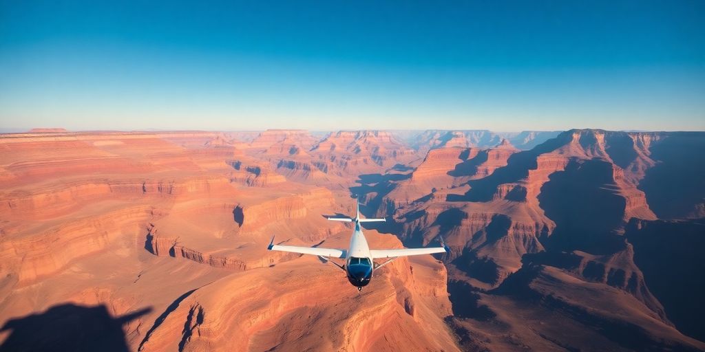 A small airplane flying over the vast Grand Canyon.