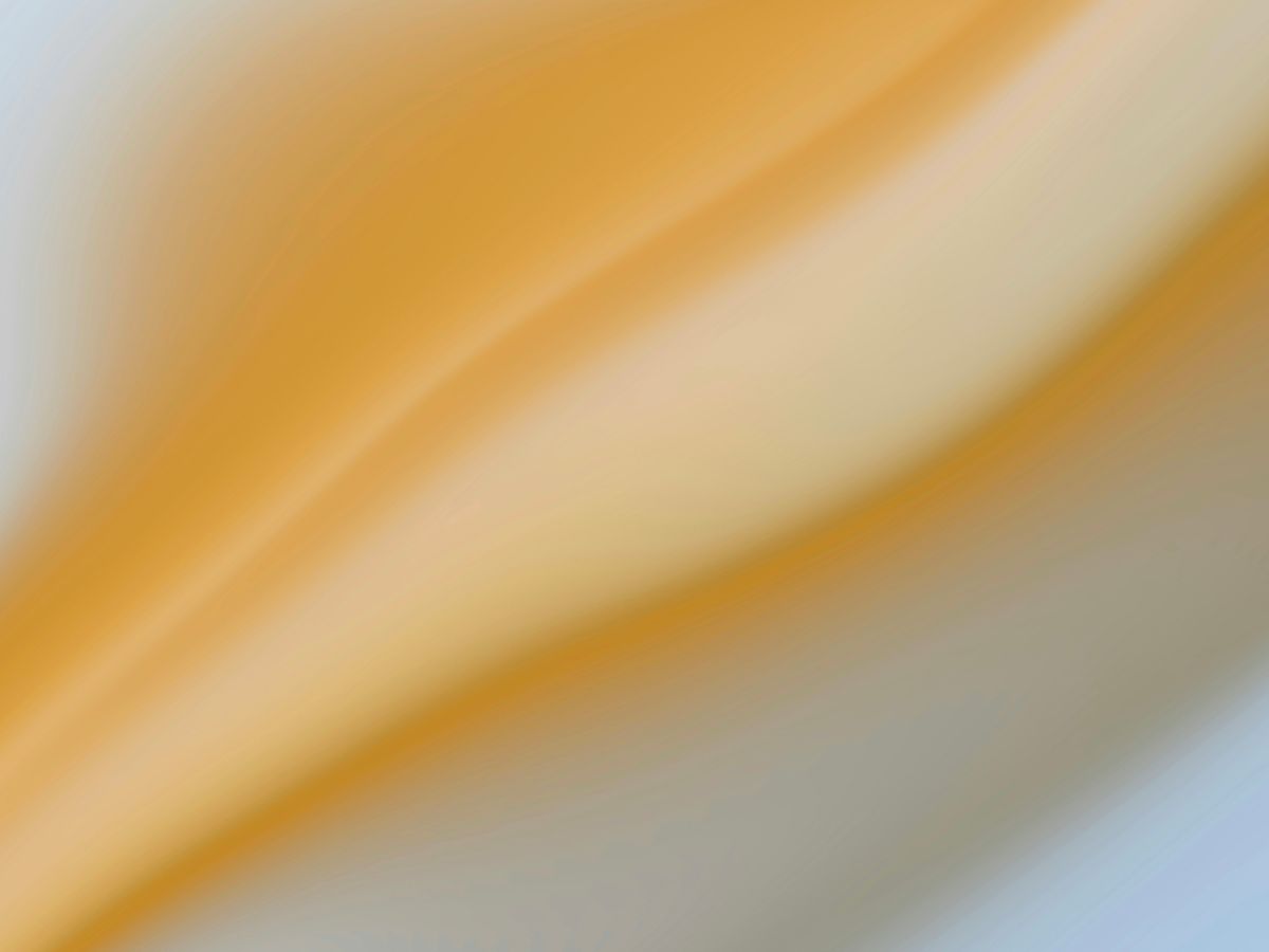 a blurry image of a yellow and white background