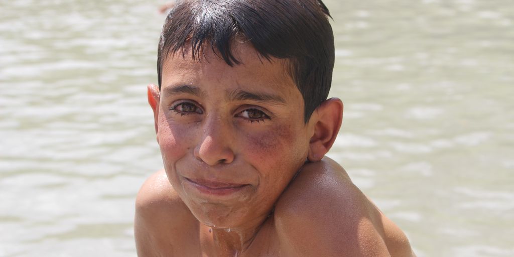 swimmer eating dried apples poolside
