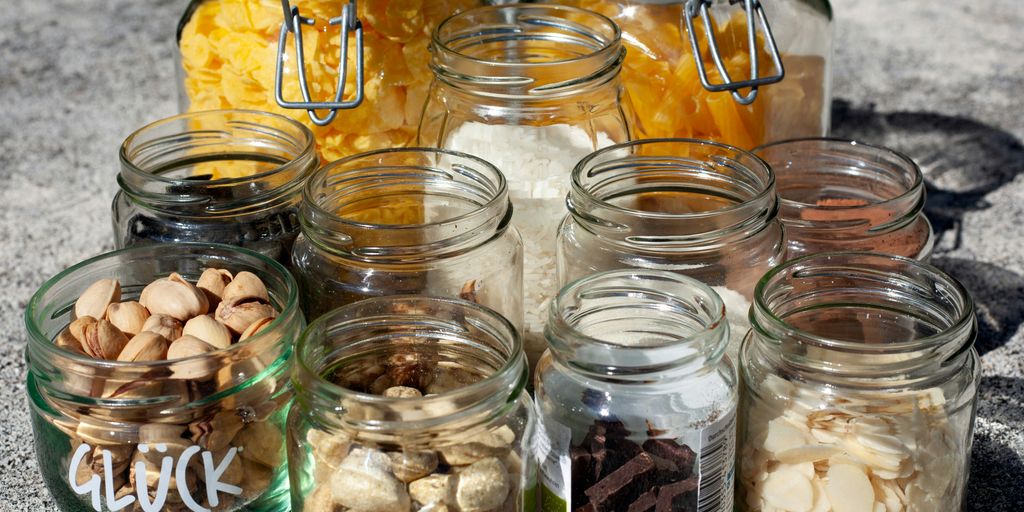clear glass jars with white and brown stones