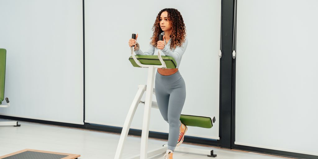 a woman using a treadmill in a room