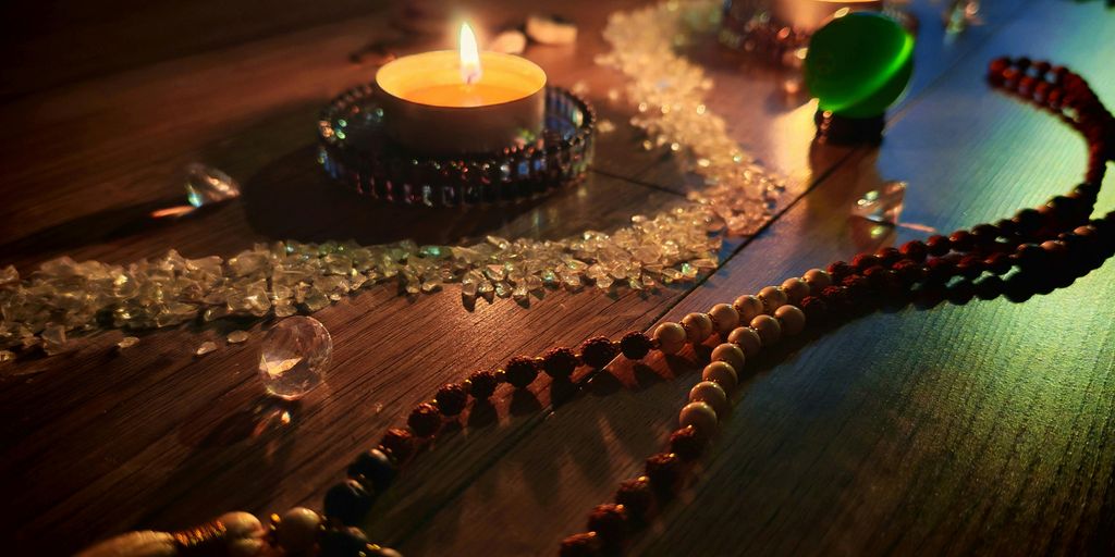 Candles, crystals, and beads create a calming ambiance.