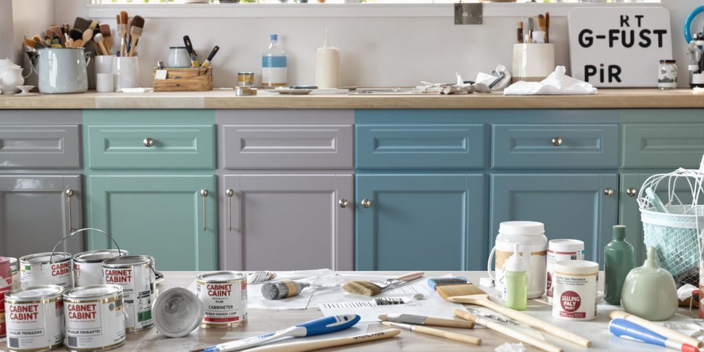 Colorful painted cabinets with tools and paint cans.