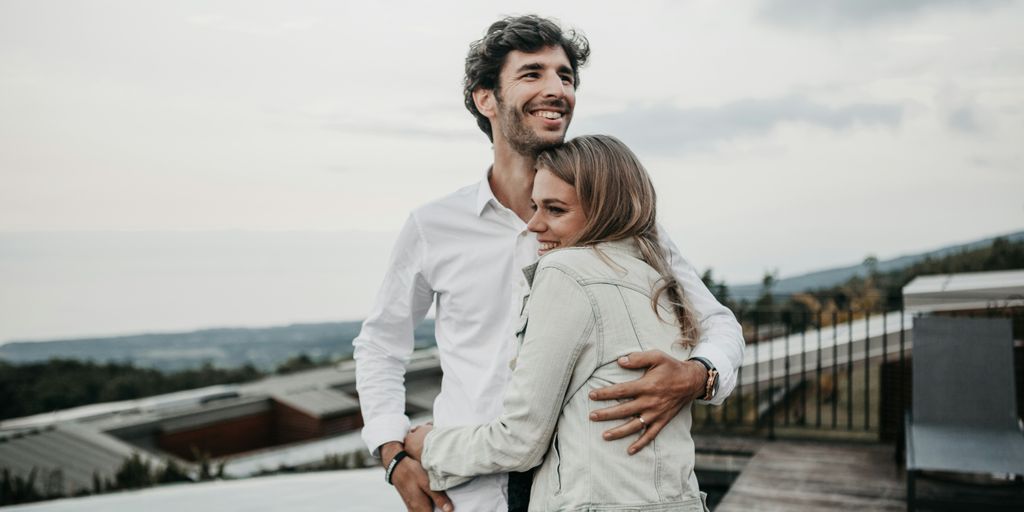 man and woman hugging each other