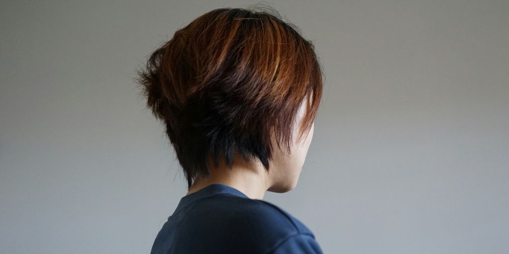 the back of a woman's head with short hair
