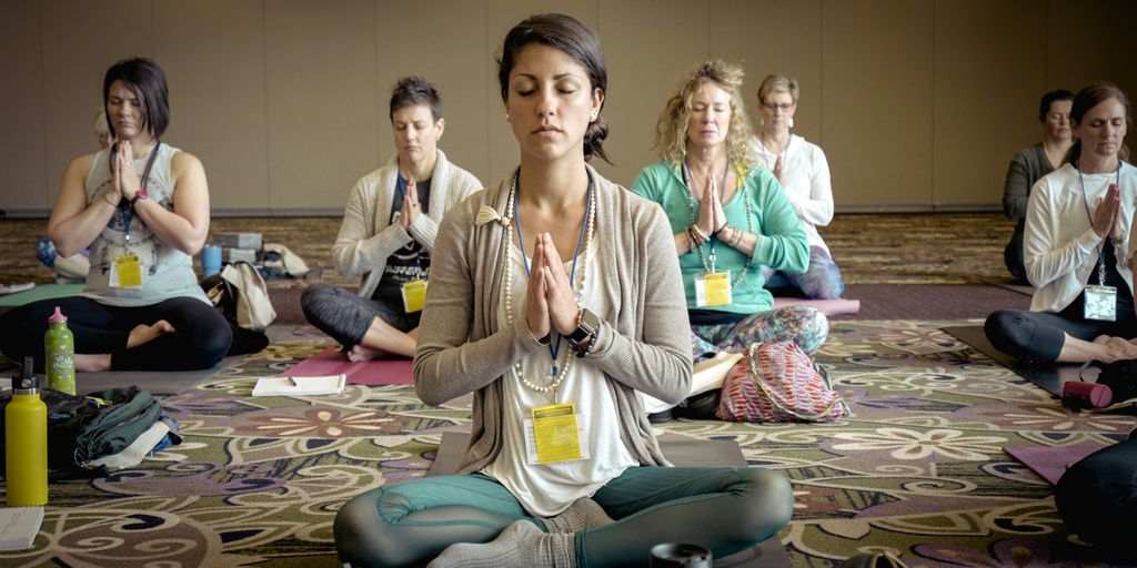 group of people doing yoga