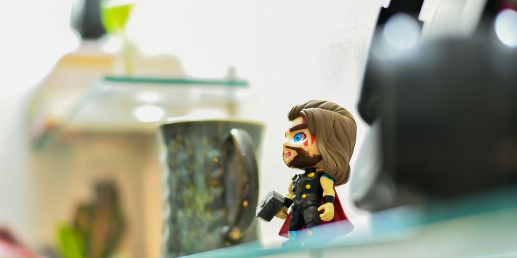 a toy figurine on a glass table