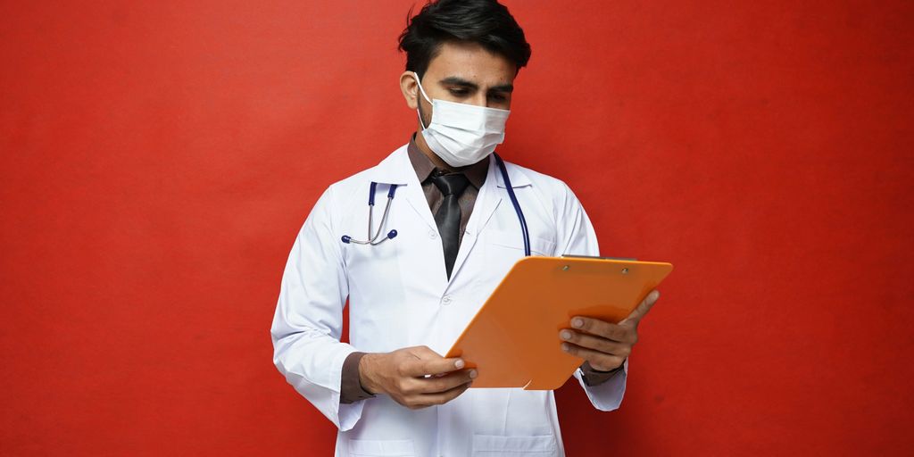 a doctor holding a tablet