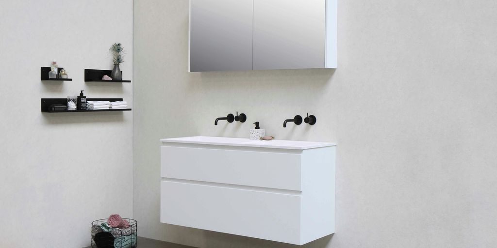 white wooden kitchen cabinet with black and white ceramic mugs on top