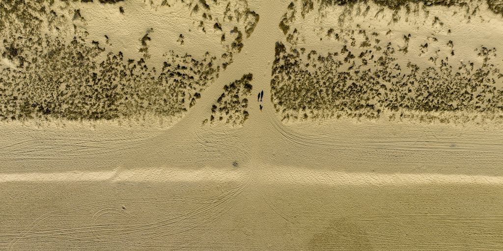 5 Signs Your Mississauga Bathroom Needs an Immediate Renovation an aerial view of a sandy beach with footprints in the sand