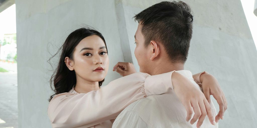 a man and a woman standing next to each other
