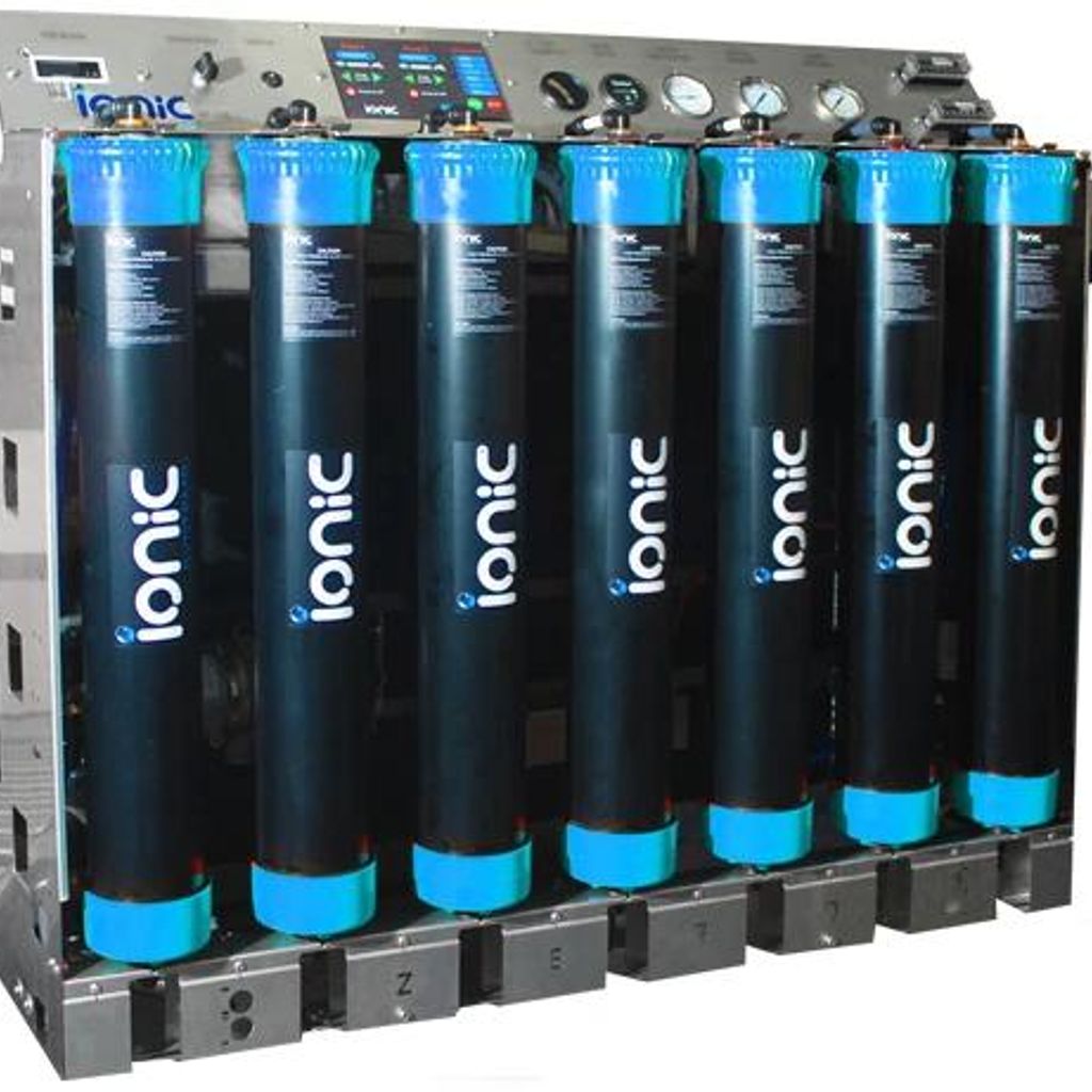 The image shows a large, blue and black filtration system.