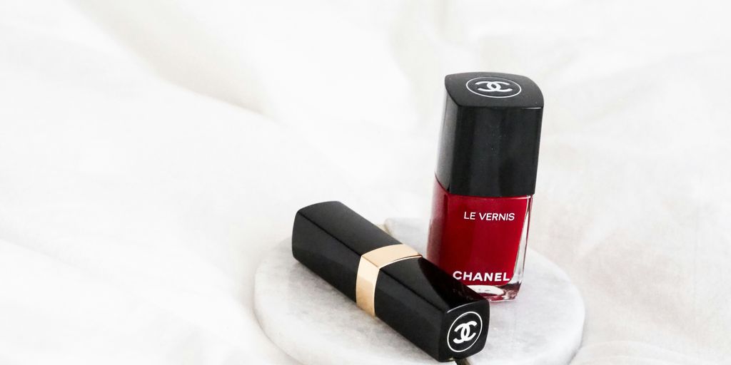 black and red lipstick on white textile