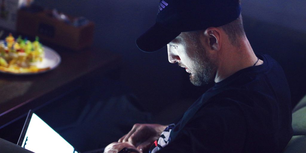 a man sitting in front of a computer