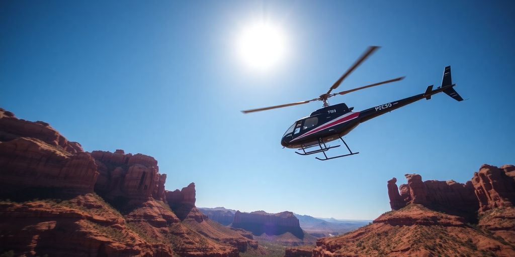 A helicopter flies over the red rock formations of Sedona.