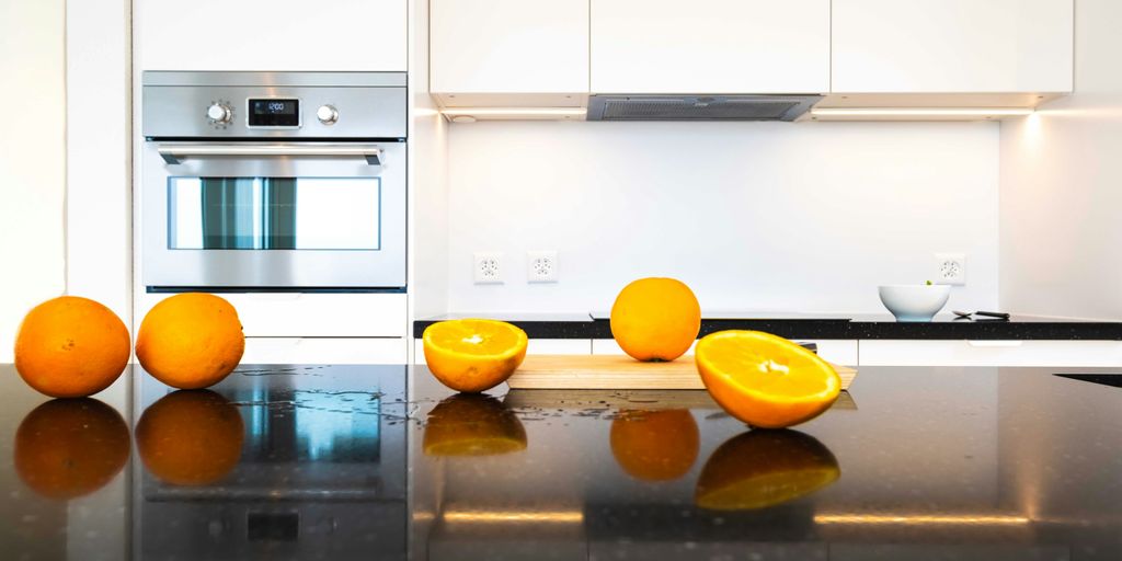 orange fruits on stainless steel kitchen counter
