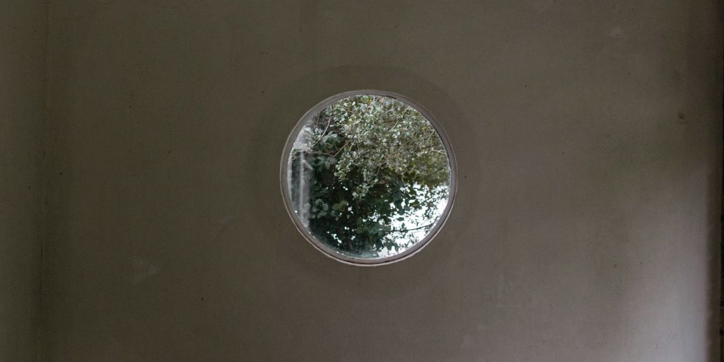 round silver ornament on white table
