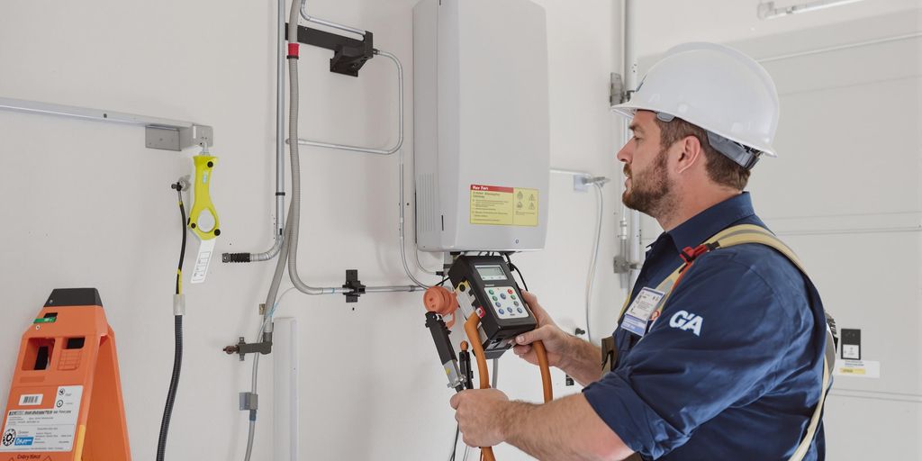 Electrician inspecting EV charger in a residential setting.