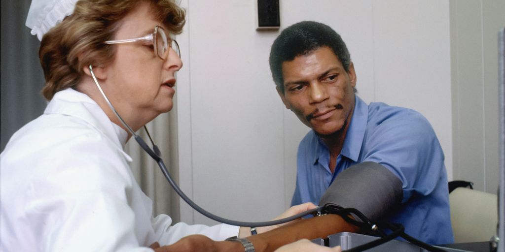 a doctor listening to a patient with a stethoscope