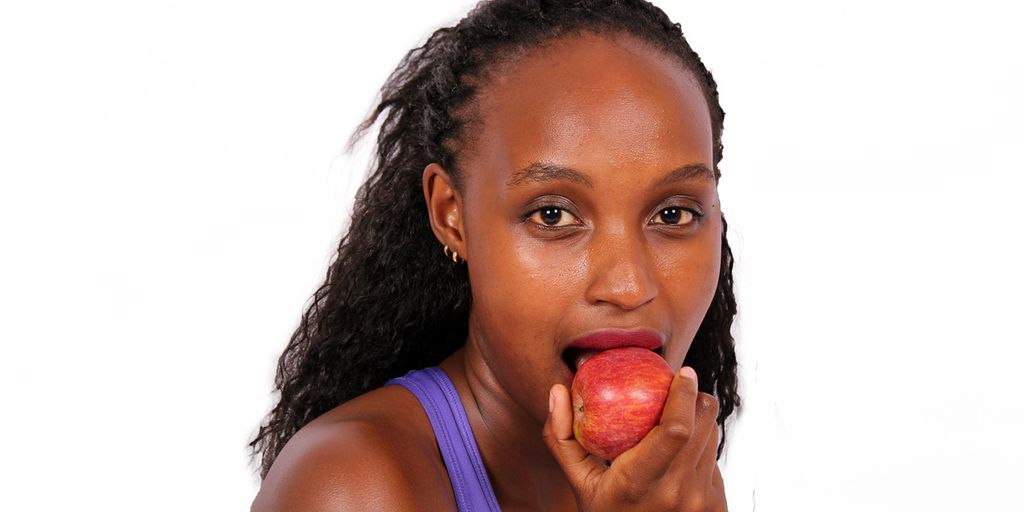 swimmer eating apple sauce poolside