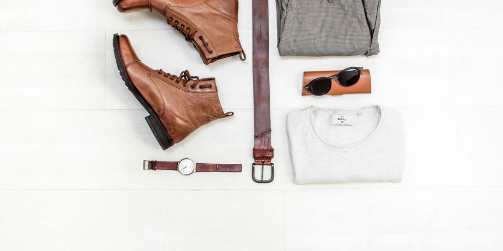 pair of brown leather boots beside bet