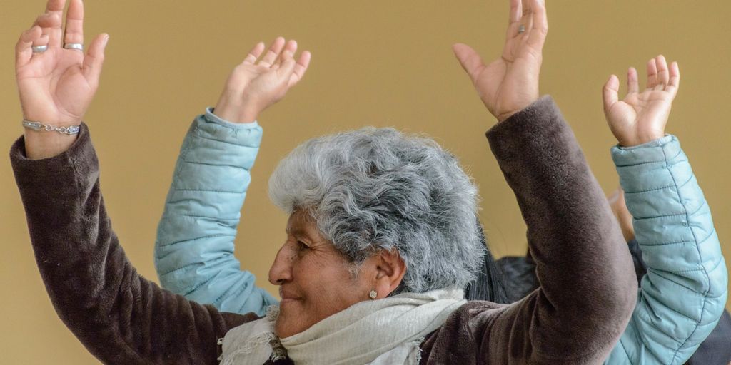 a woman with her hands up in the air