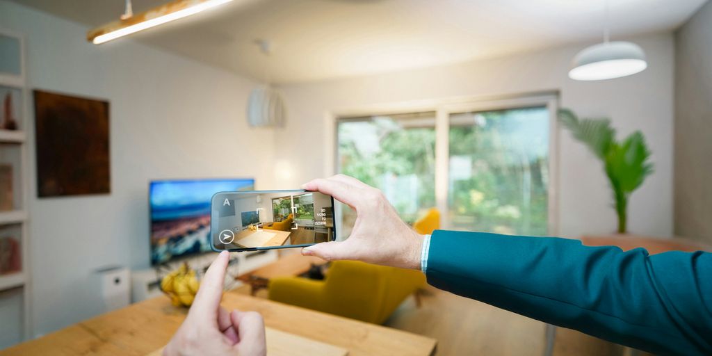 A person taking a picture of a living room