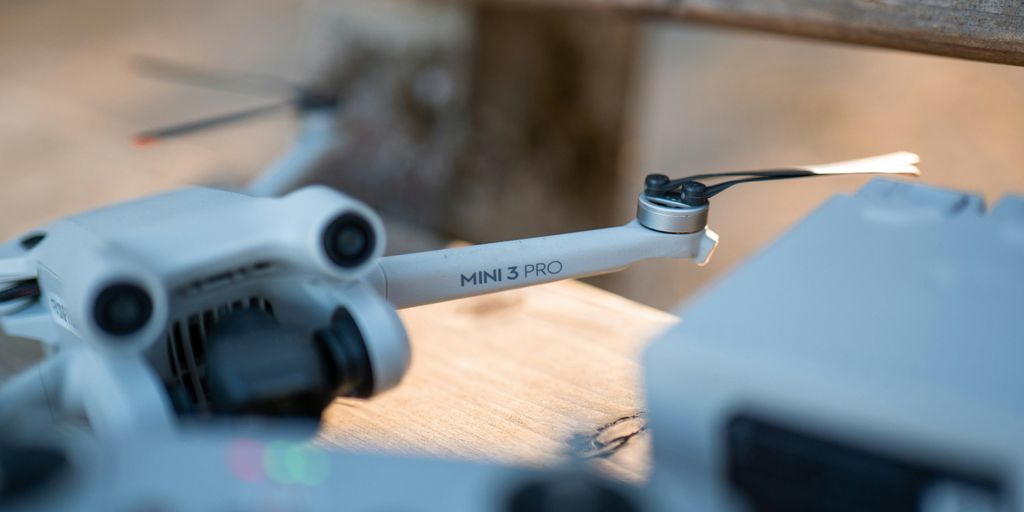 A drone and its remote control are in focus.