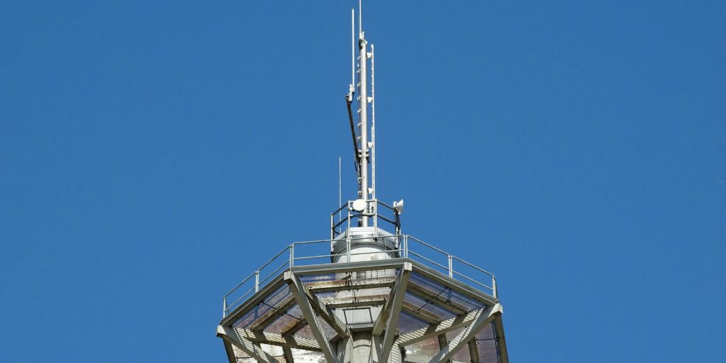 white and black tower under blue sky during daytime