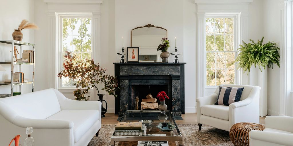 A living room filled with furniture and a fire place