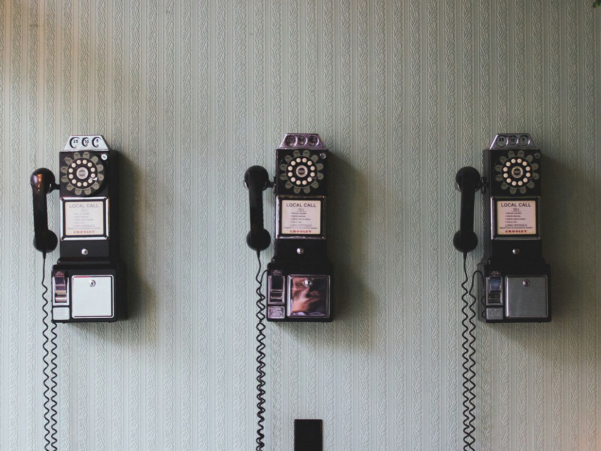 minimalist photography of three crank phones