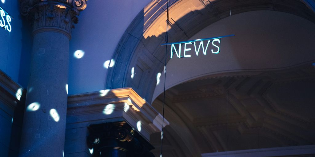 a building with a sign on the roof